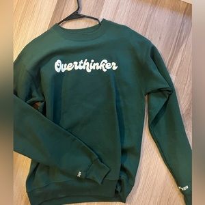 Overthinker crewneck with breathe in on the left sleeve and breathe out on right